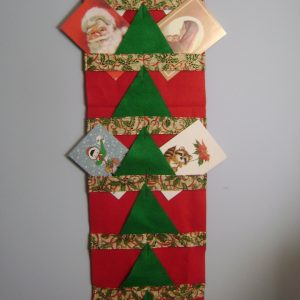 Fabric is my favorite one for Christmas. It has red ribbon and green ivy with gold highlights.